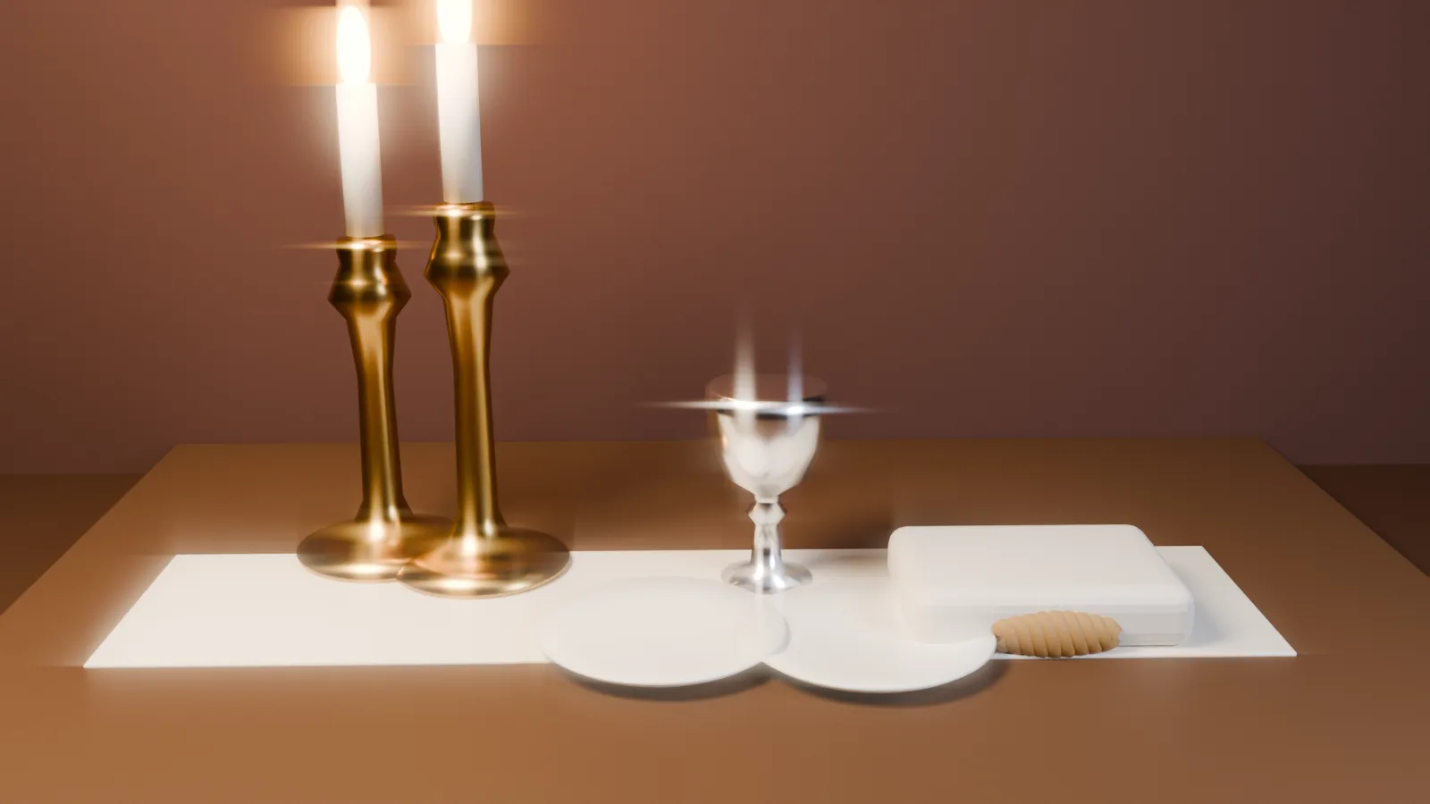 A Shabbat table set for Friday night: two lit candles, a silver kiddush cup, and a challah resting under its cover, all in warm candlelight